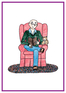 Bald man sitting in easy chair, reading a book